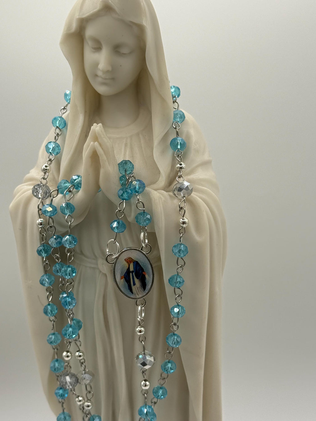 Light Blue Crystal Rosary with Mother Mary Centerpiece.