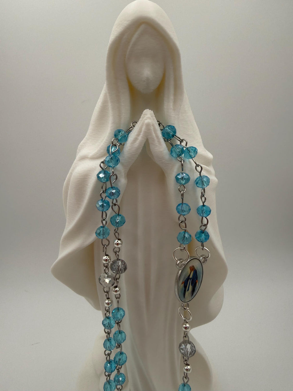 Light Blue Crystal Rosary with Mother Mary Centerpiece.